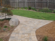 custom designed stone walkway and maintained lawn