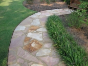 custom designed stone walkway and maintained lawn