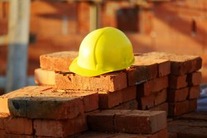 construction hat on brick wall